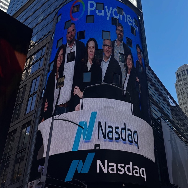 Micheal Sheehy and Payoneer colleagues displayed on the Nasdaq MarketSite tower in Times Square
