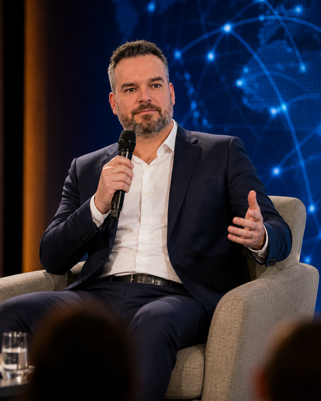 AI-created visualization of Micheal Sheehy speaking during a fireside discussion
