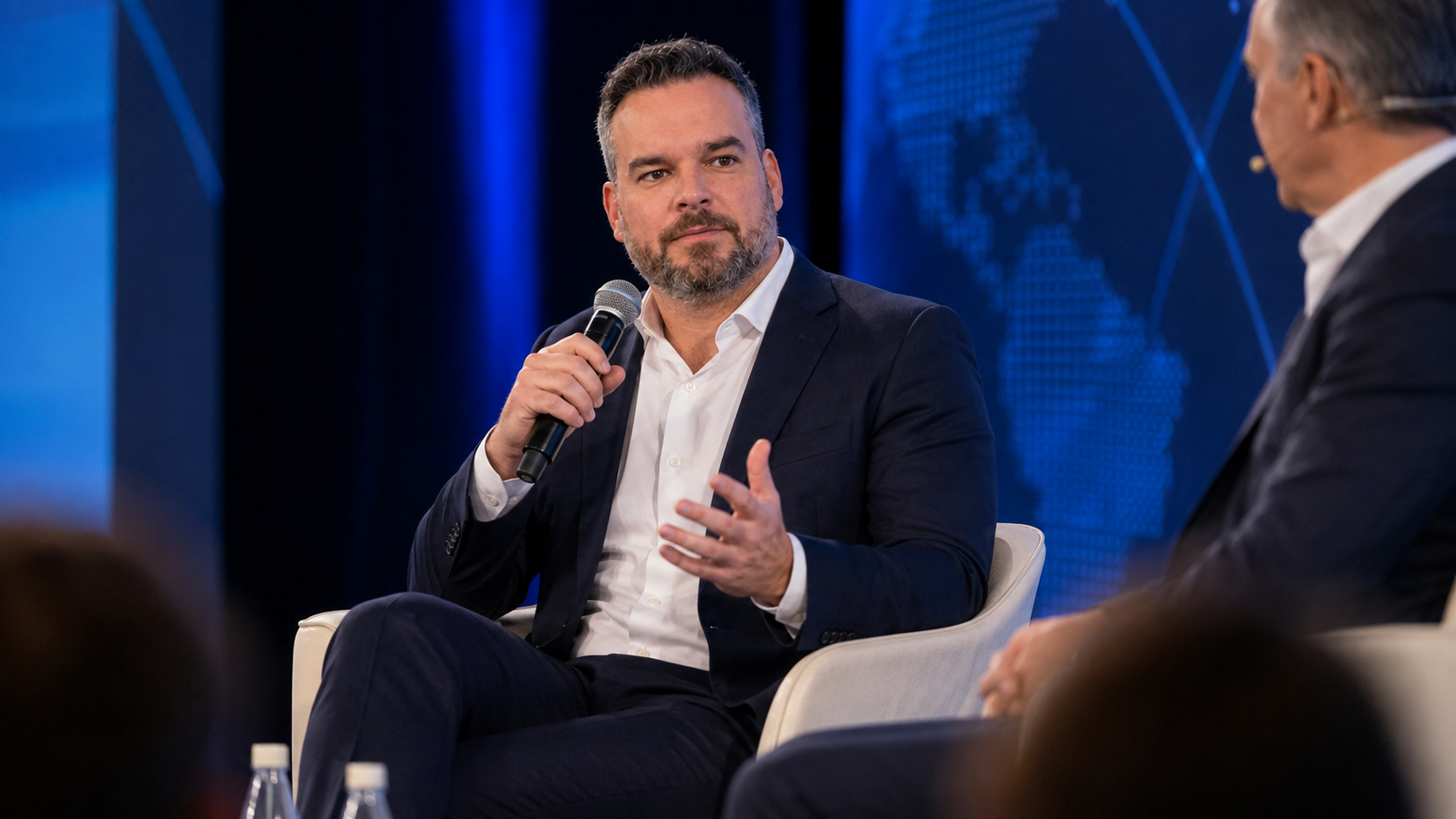 AI-created visualization of Micheal Sheehy participating in a conference panel