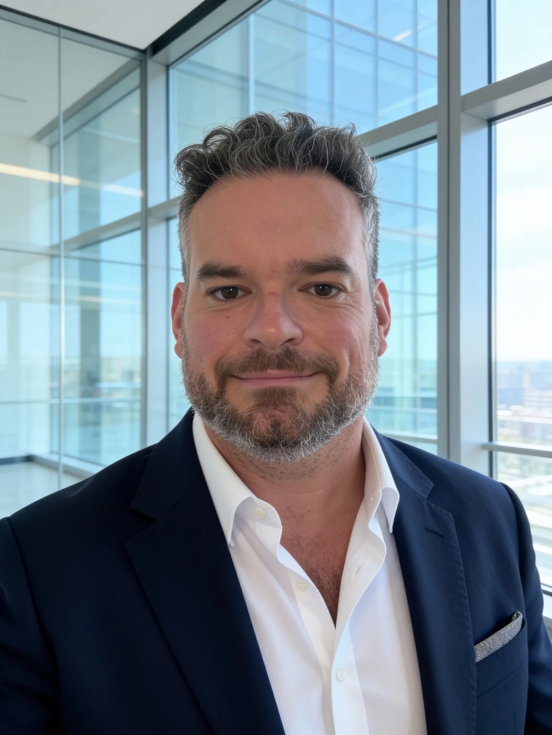 Portrait of Micheal Sheehy in a modern office